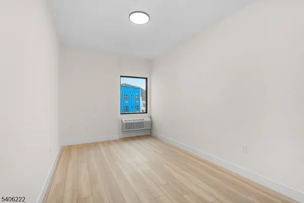 a view of an empty room and window