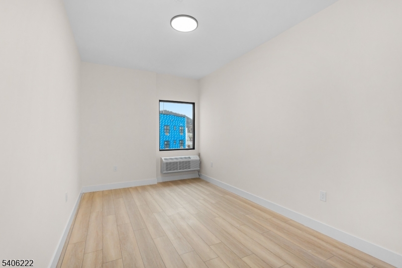 87-89 Mary Street, Unit 503 Paterson, NJ 07503 - Photo 10 of 14 a view of an empty room and window