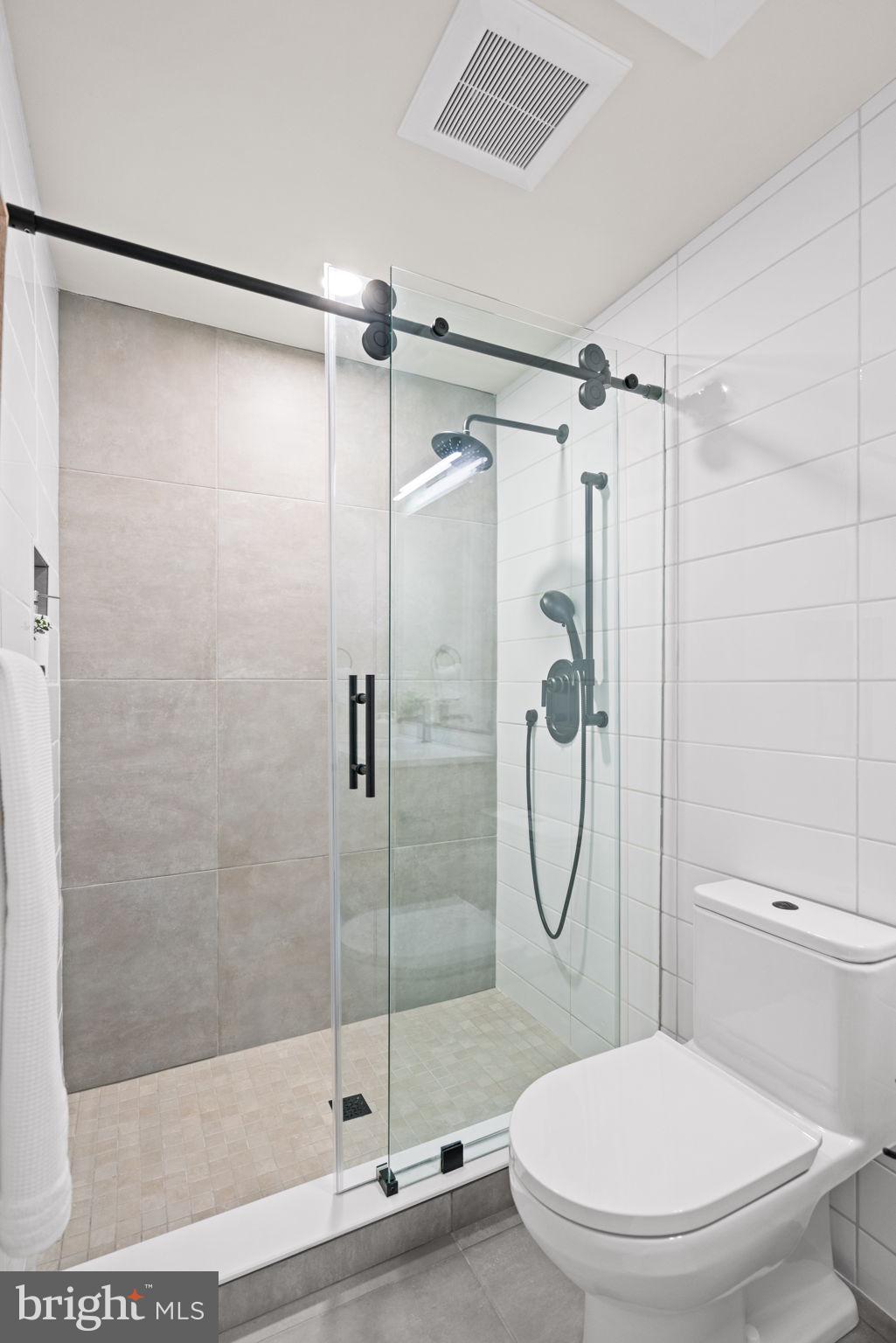 733 8th Street Southeast, Unit 303 Washington, DC 20003 - Photo 11 of 18 a bathroom with a toilet and a shower