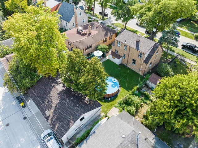 an aerial view of a house with a yard patio and garden