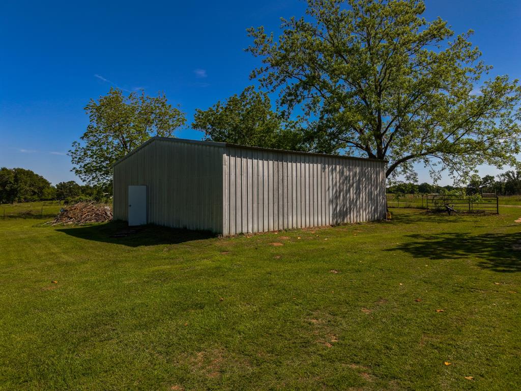 682 Lcr 450 Groesbeck, TX 76642 - Photo 37 of 38 a backyard of a house with lots of green space and garden