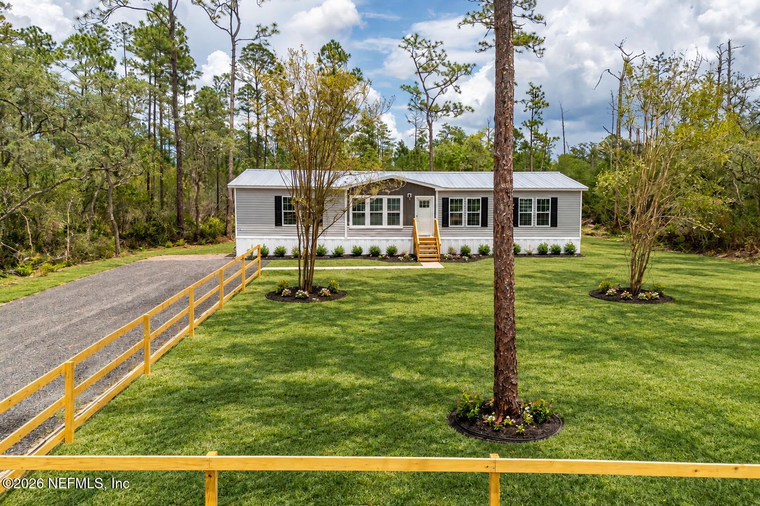 230 Red Eye Road Florahome, FL 32140 - Photo 1 of 38 AI Generated grass in front yard photo