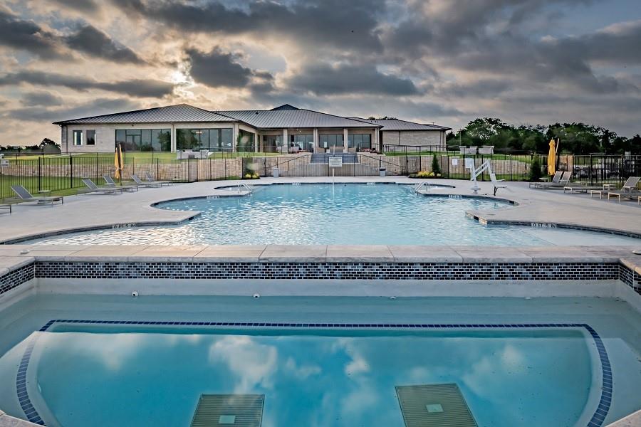 2715 Triumph Court Heath, TX 75126 - Photo 22 of 30 a view of a house with a swimming pool