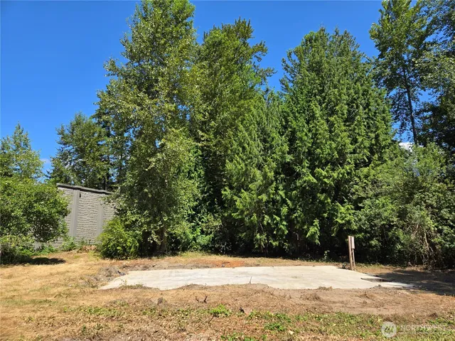 a view of snow on the side of a road
