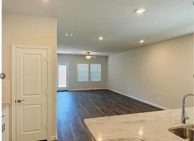 a view of a backyard with a garden and garage