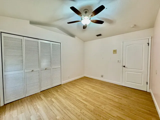 an empty room with wooden floor