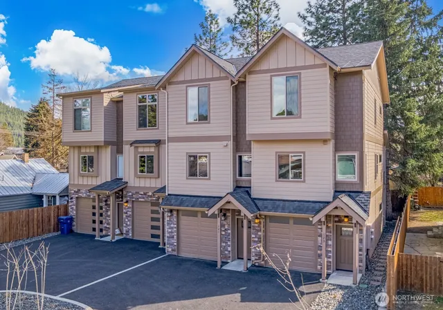 a front view of a house with parking area