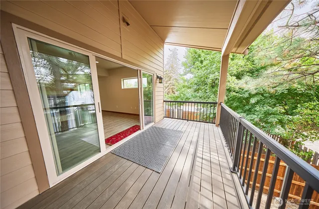 a kitchen with a refrigerator sink and cabinets