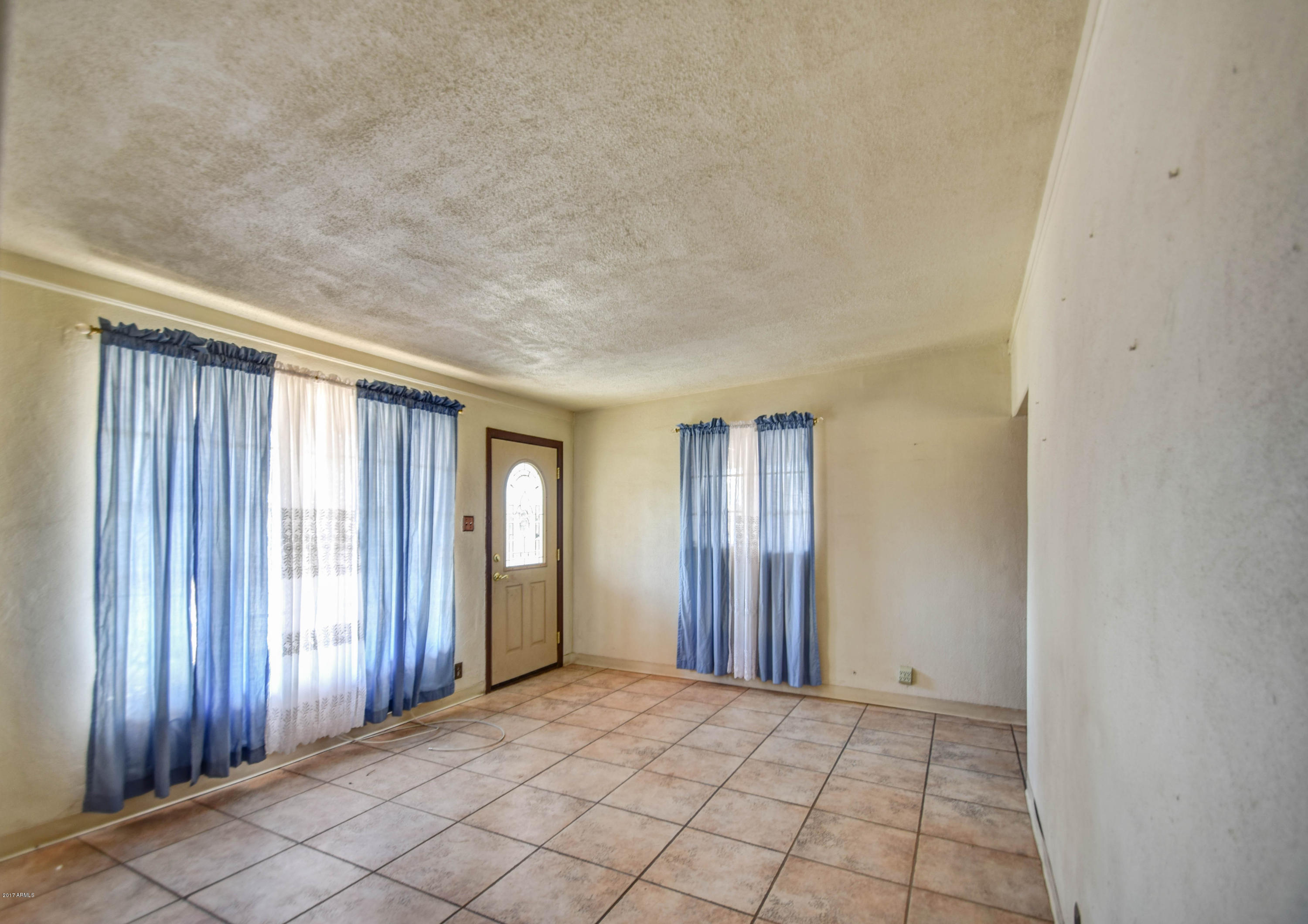 1644 West Chipman Road Phoenix, AZ 85041 - Photo 6 of 24 family room 3