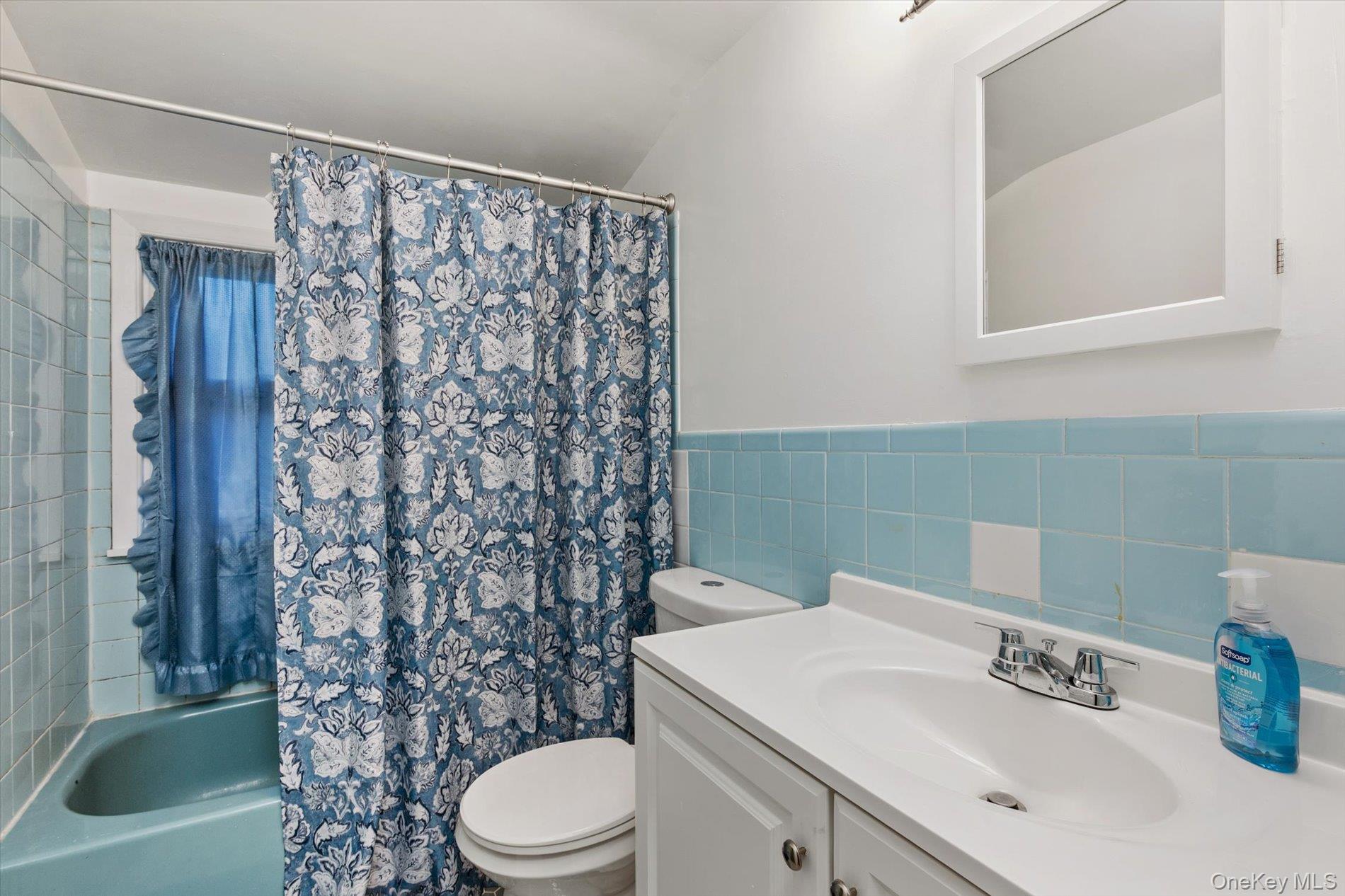 2271 Locust Street Merrick, NY 11566 - Photo 14 of 24 a bathroom with a sink toilet and shower