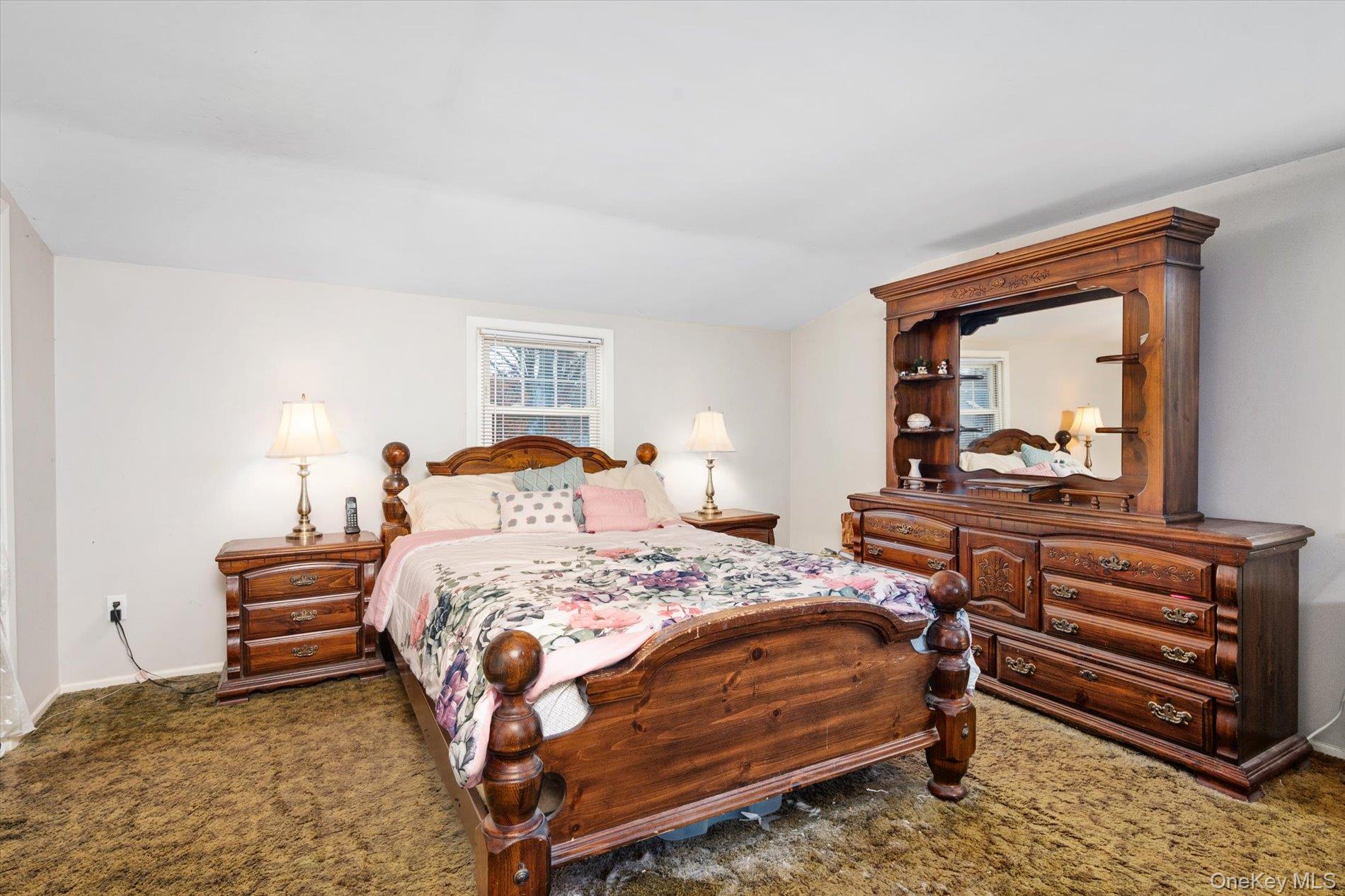 2271 Locust Street Merrick, NY 11566 - Photo 15 of 24 a bedroom with a bed and a dresser