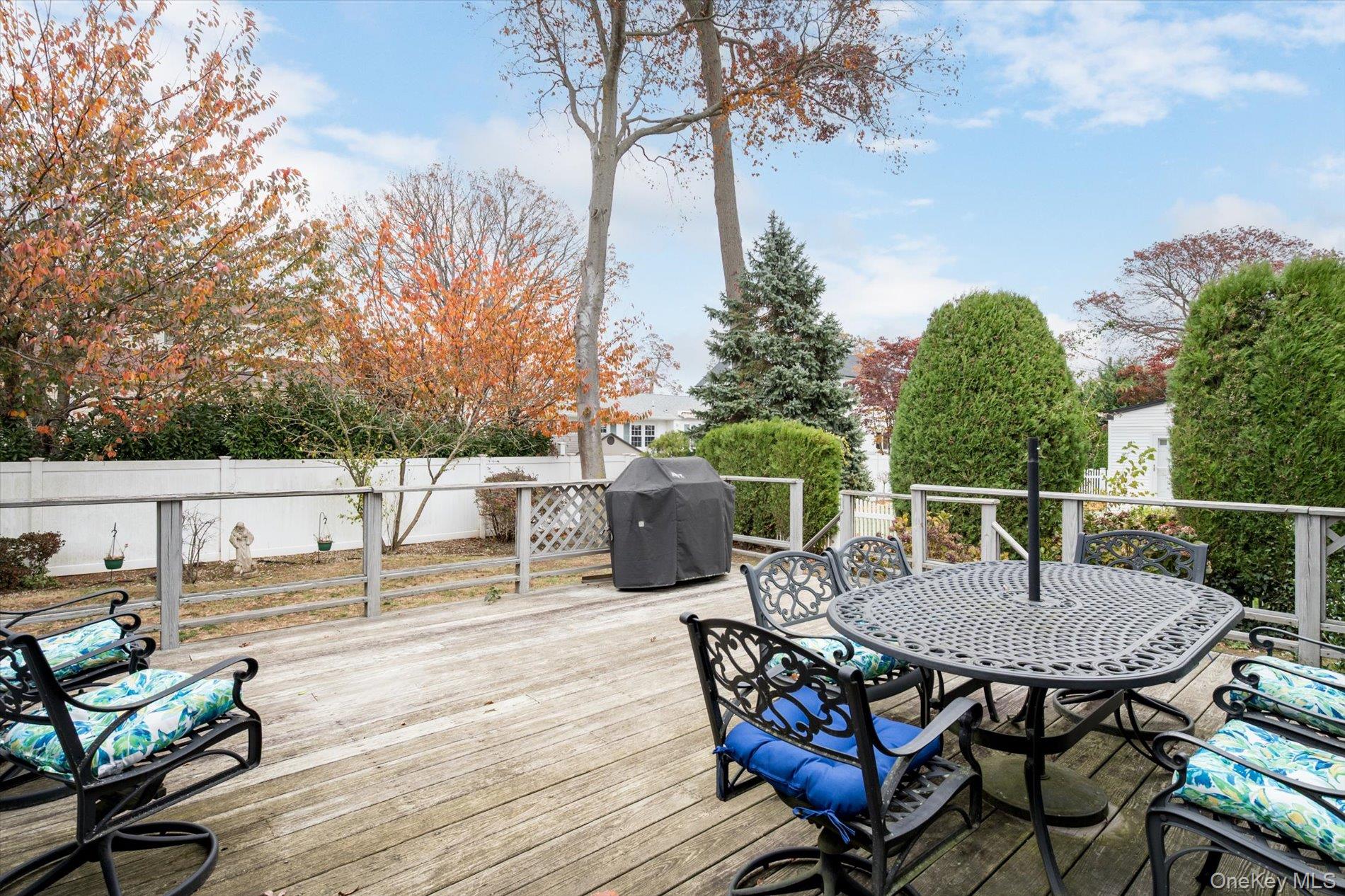 2271 Locust Street Merrick, NY 11566 - Photo 17 of 24 a view of a chairs and table on the deck