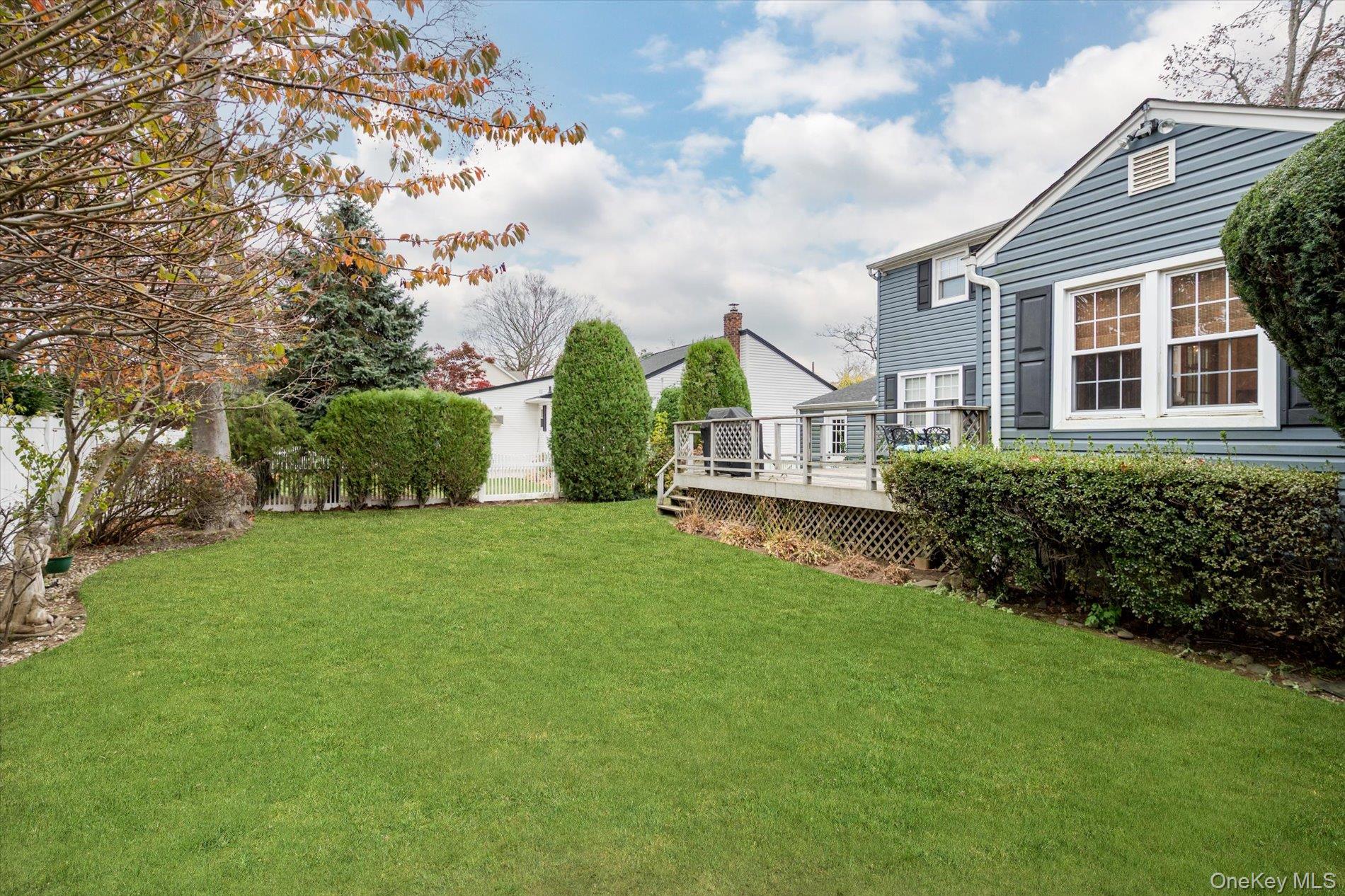 2271 Locust Street Merrick, NY 11566 - Photo 20 of 24 a view of an house with backyard space and garden