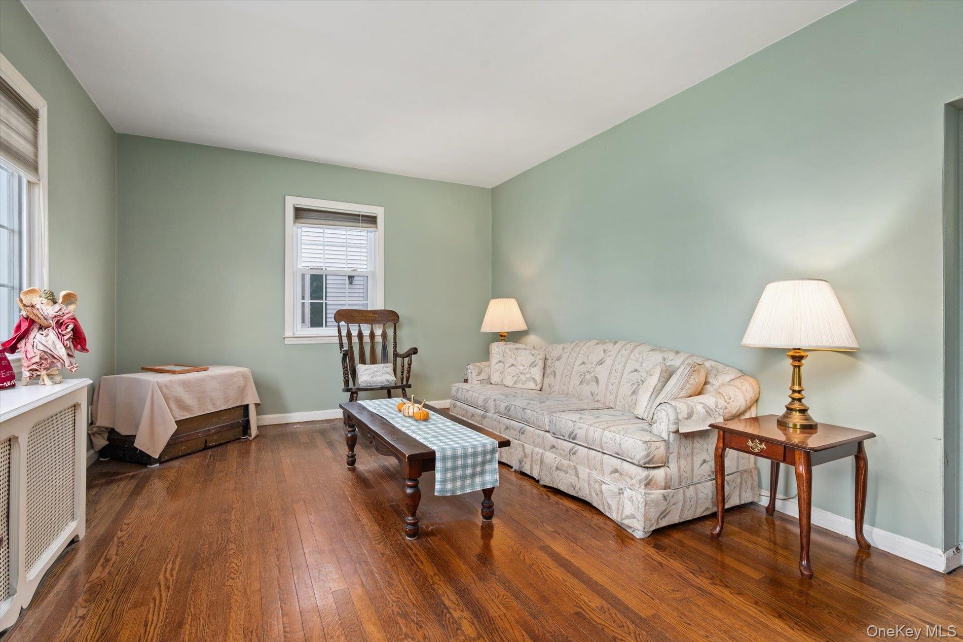 2271 Locust Street Merrick, NY 11566 - Photo 6 of 24 a living room with a bed furniture and a window