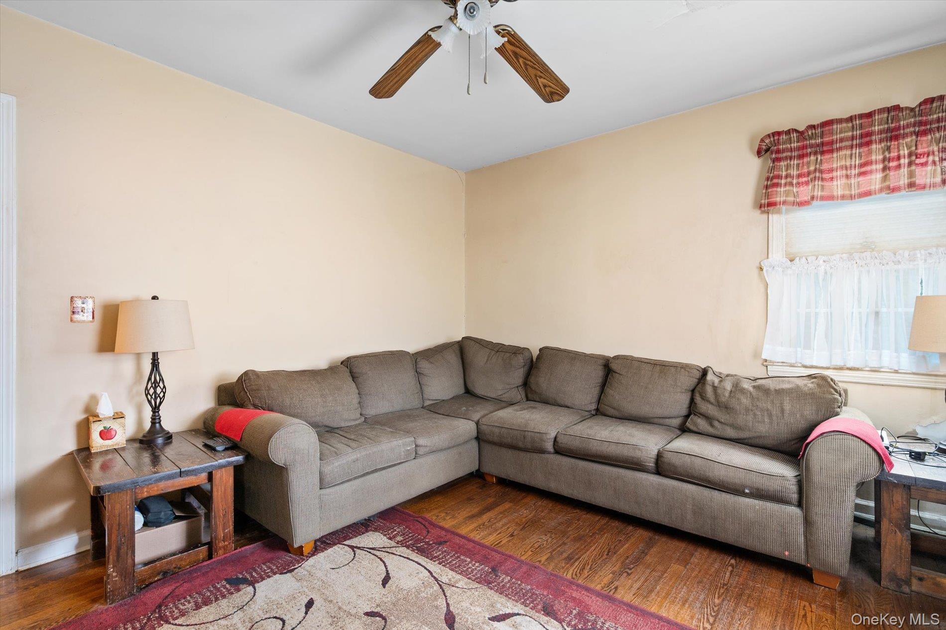 2271 Locust Street Merrick, NY 11566 - Photo 10 of 24 a living room with furniture and a couch