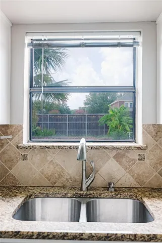 a view of a sink and a window