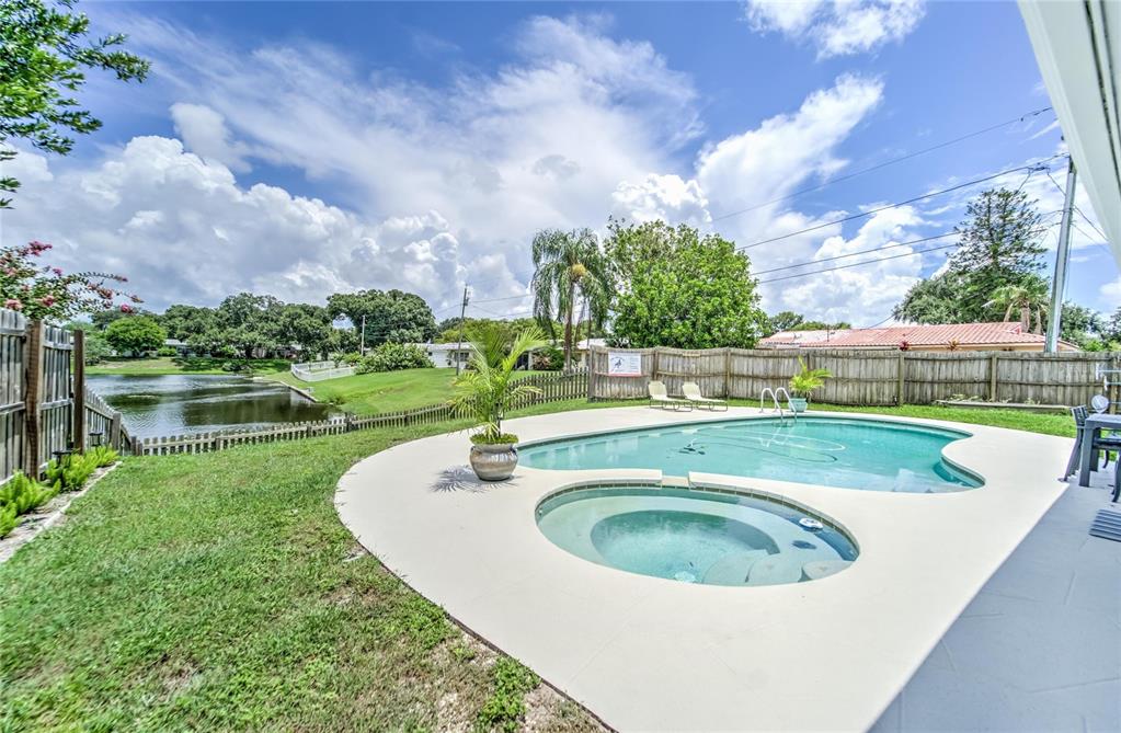 2084 Forest Drive Clearwater, FL 33763 - Photo 1 of 1 a view of a swimming pool with a yard