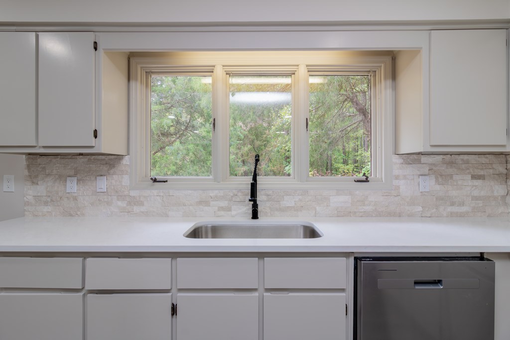 8585 McKee Road Upatoi, GA 31829 - Photo 13 of 62 a kitchen with a sink and a window