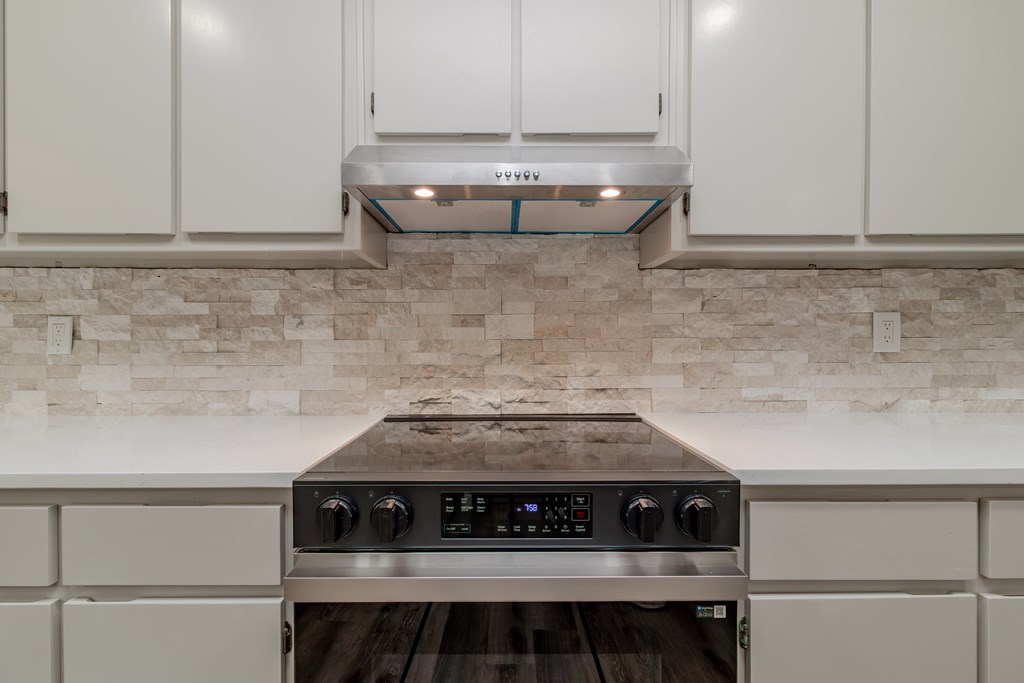 8585 McKee Road Upatoi, GA 31829 - Photo 16 of 62 a stove top oven sitting inside of a kitchen