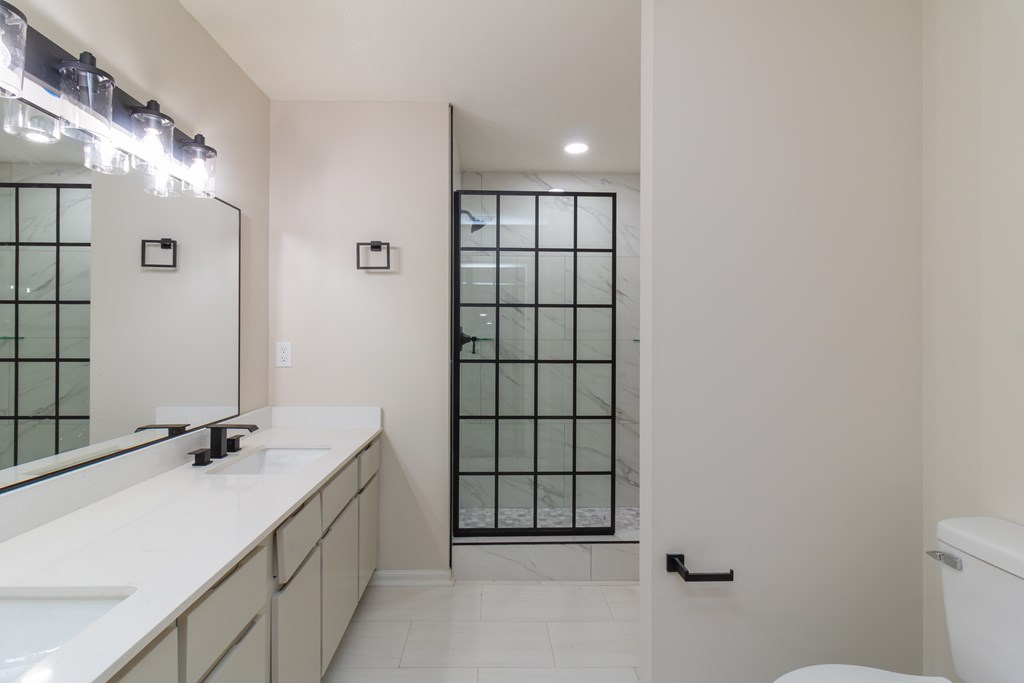 8585 McKee Road Upatoi, GA 31829 - Photo 25 of 62 a bathroom with a sink and a mirror