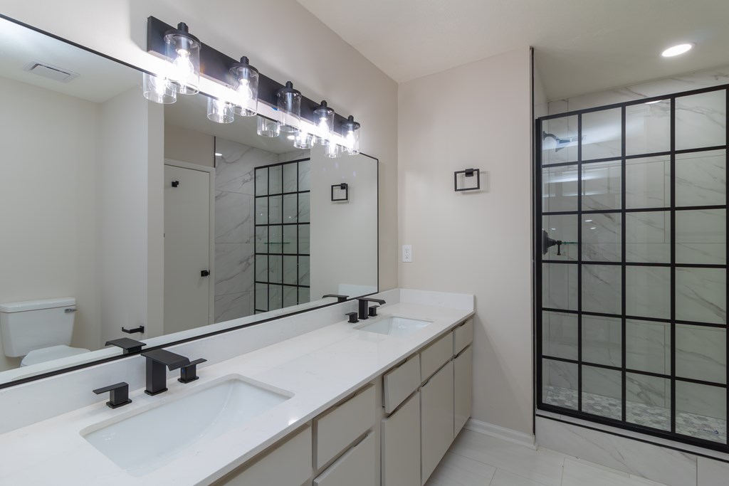 8585 McKee Road Upatoi, GA 31829 - Photo 26 of 62 a bathroom with a sink and a mirror