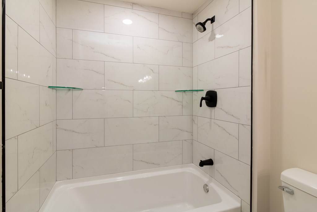 8585 McKee Road Upatoi, GA 31829 - Photo 30 of 62 a bathroom with a shower and a toilet