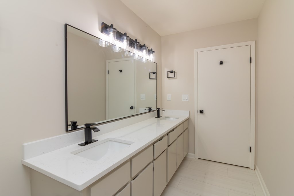 8585 McKee Road Upatoi, GA 31829 - Photo 32 of 62 a bathroom with a sink and a mirror