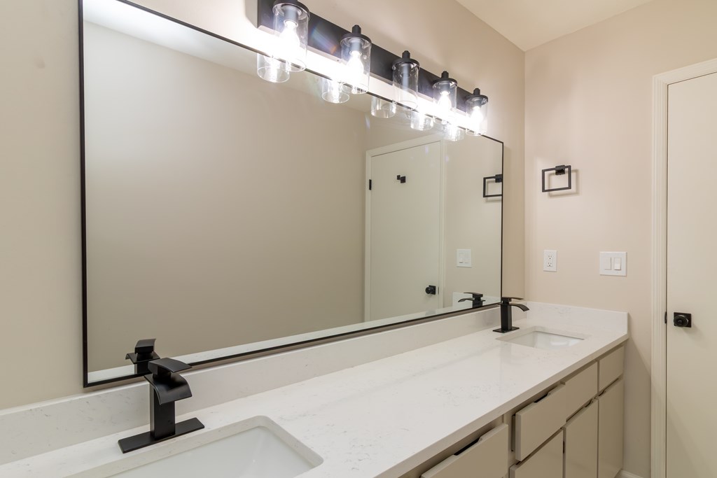 8585 McKee Road Upatoi, GA 31829 - Photo 33 of 62 a bathroom with a sink and a mirror