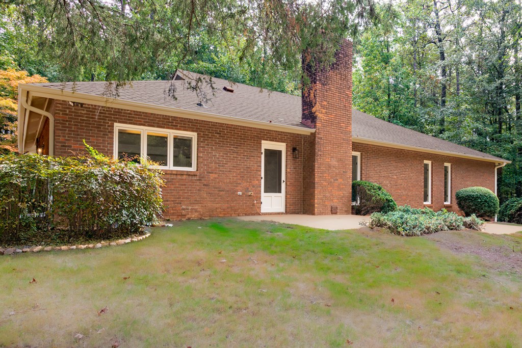 8585 McKee Road Upatoi, GA 31829 - Photo 42 of 62 front view of a house with a yard
