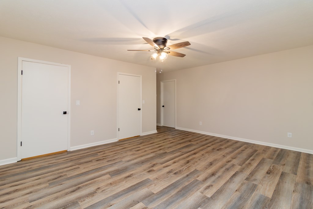8585 McKee Road Upatoi, GA 31829 - Photo 49 of 62 a view of an empty room with wooden floor