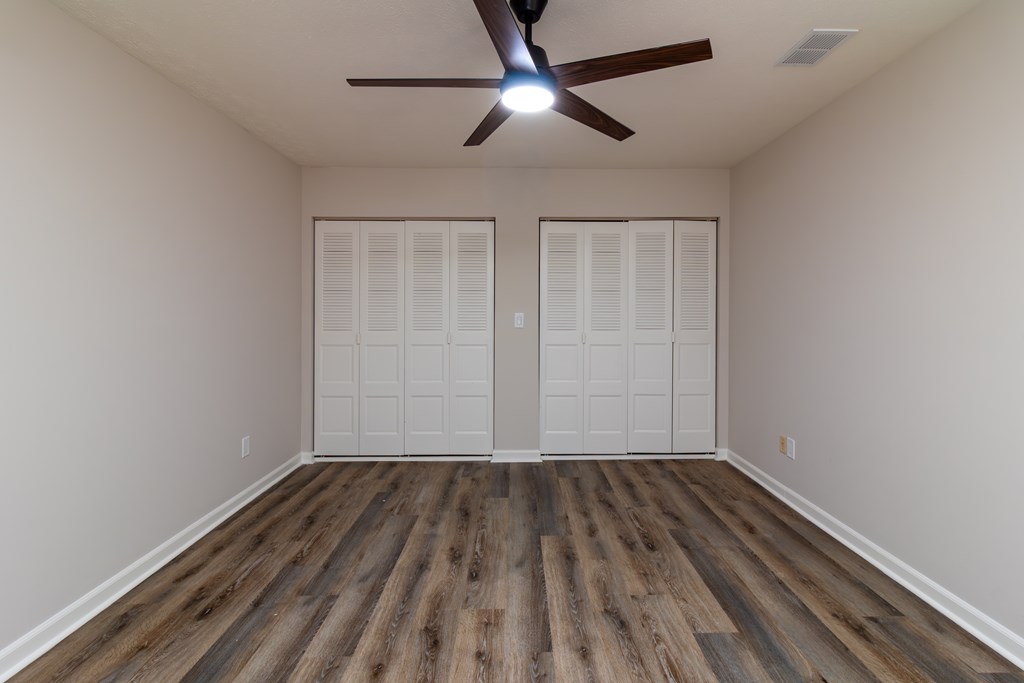 8585 McKee Road Upatoi, GA 31829 - Photo 54 of 62 a view of room with window ceiling fan and wooden floor