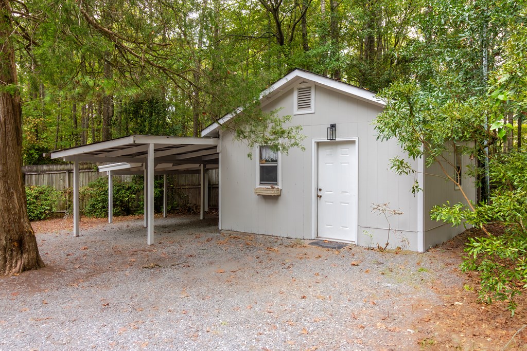 8585 McKee Road Upatoi, GA 31829 - Photo 61 of 62 a view of a house with a yard and potted plants