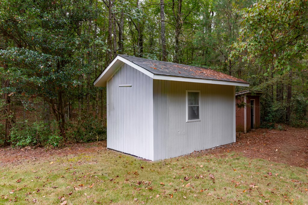 8585 McKee Road Upatoi, GA 31829 - Photo 62 of 62 a backyard of a house with lots of green space