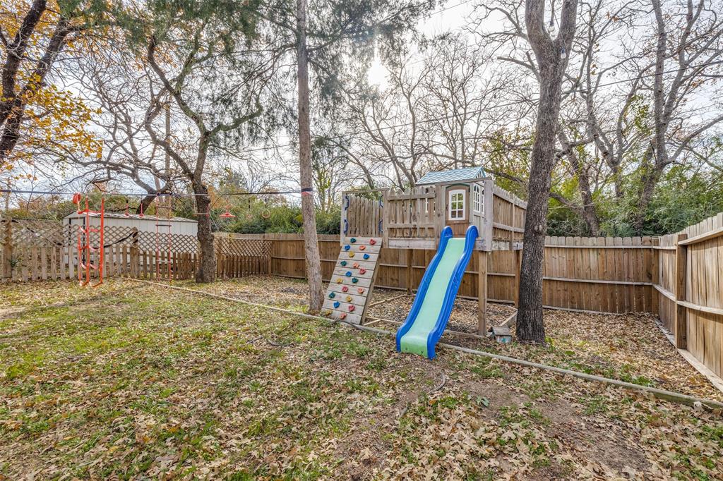 500 Lake Crest Parkway Azle, TX 76020 - Photo 18 of 23 a view of a yard with a slide