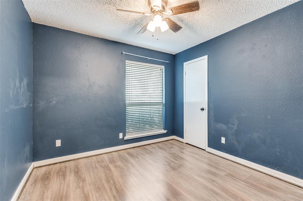 500 Lake Crest Parkway Azle, TX 76020 - Photo 9 of 23 a view of an empty room with chandelier fan and a window