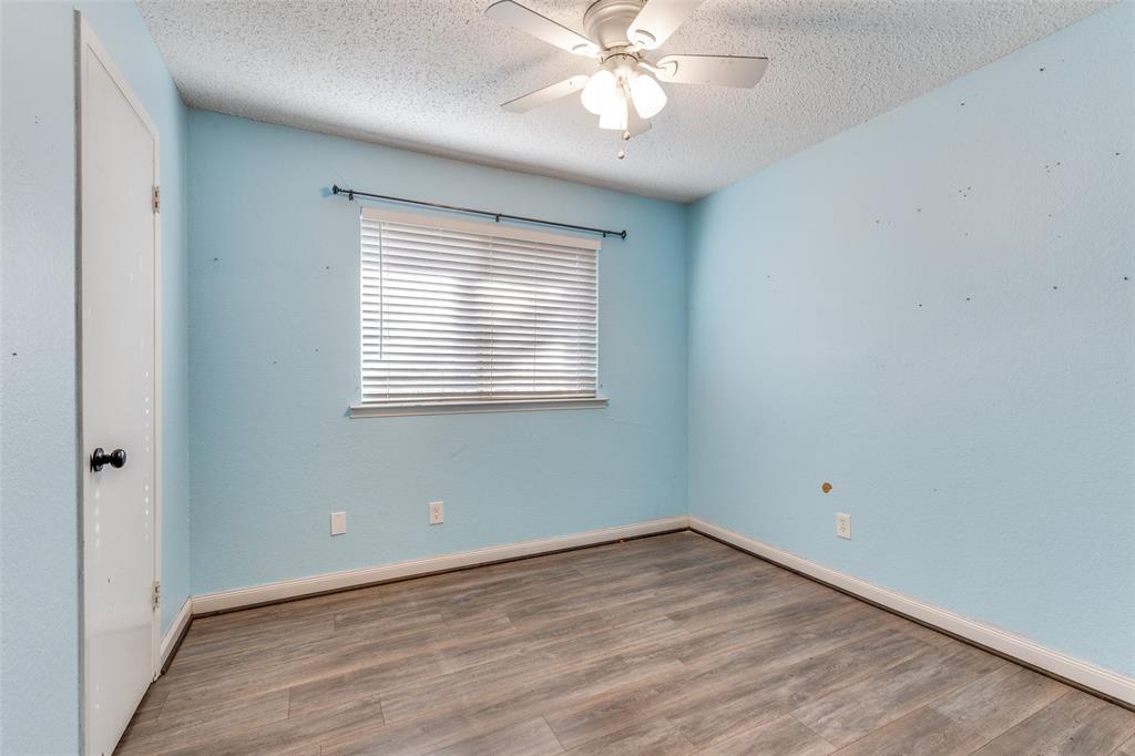 500 Lake Crest Parkway Azle, TX 76020 - Photo 10 of 23 wooden floor in an empty room with a window