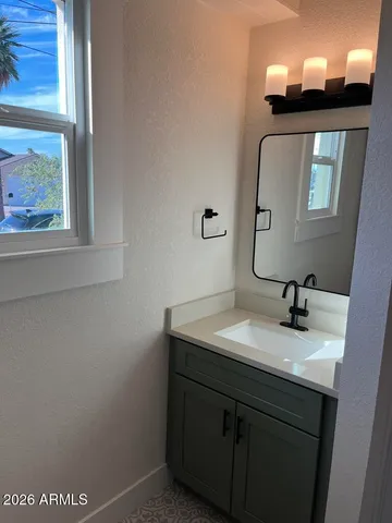 a bathroom with a sink and a mirror