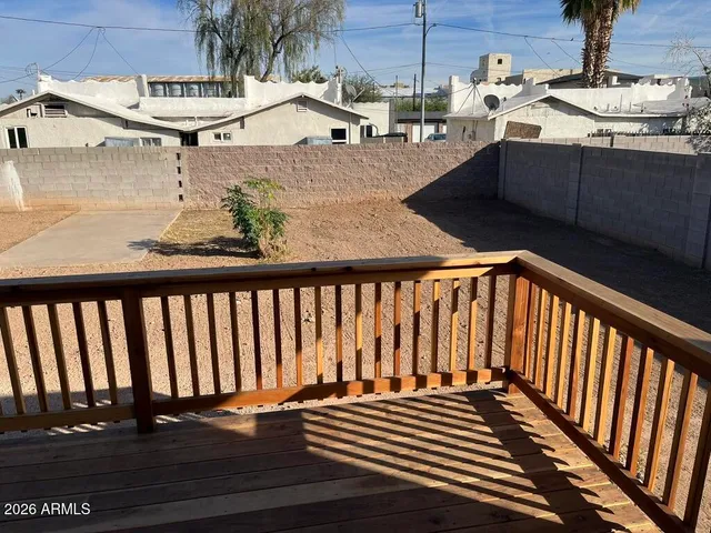 a balcony with wooden floor