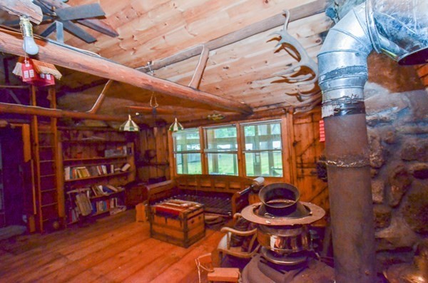 23 Pine Acres Road Spencer, MA 01562 - Photo 11 of 15 a outdoor living space with furniture and a fireplace