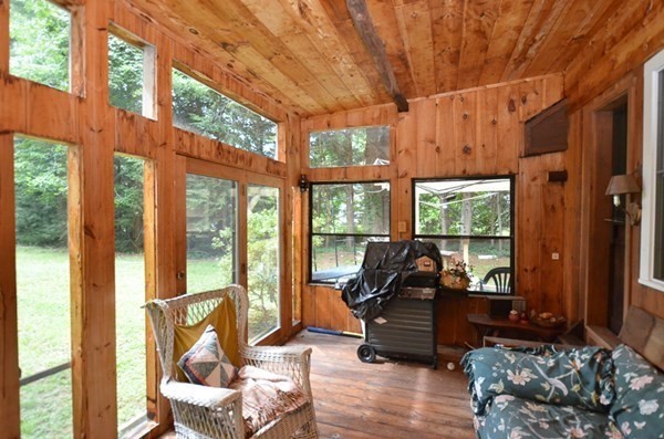 23 Pine Acres Road Spencer, MA 01562 - Photo 15 of 15 a living room with furniture and floor to ceiling windows