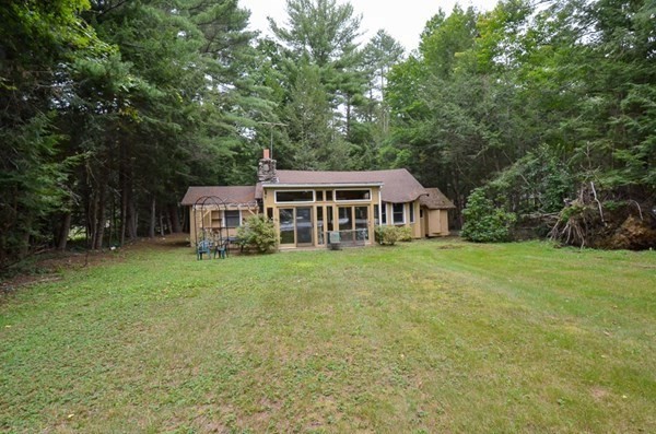 23 Pine Acres Road Spencer, MA 01562 - Photo 3 of 15 a view of a house with backyard and sitting area