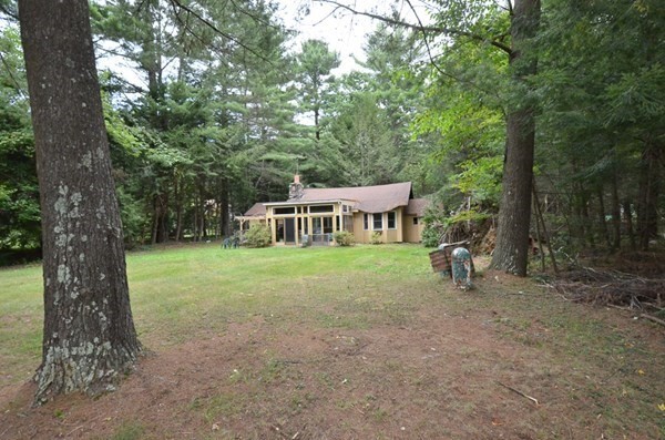 23 Pine Acres Road Spencer, MA 01562 - Photo 4 of 15 a view of a house with backyard and a tree