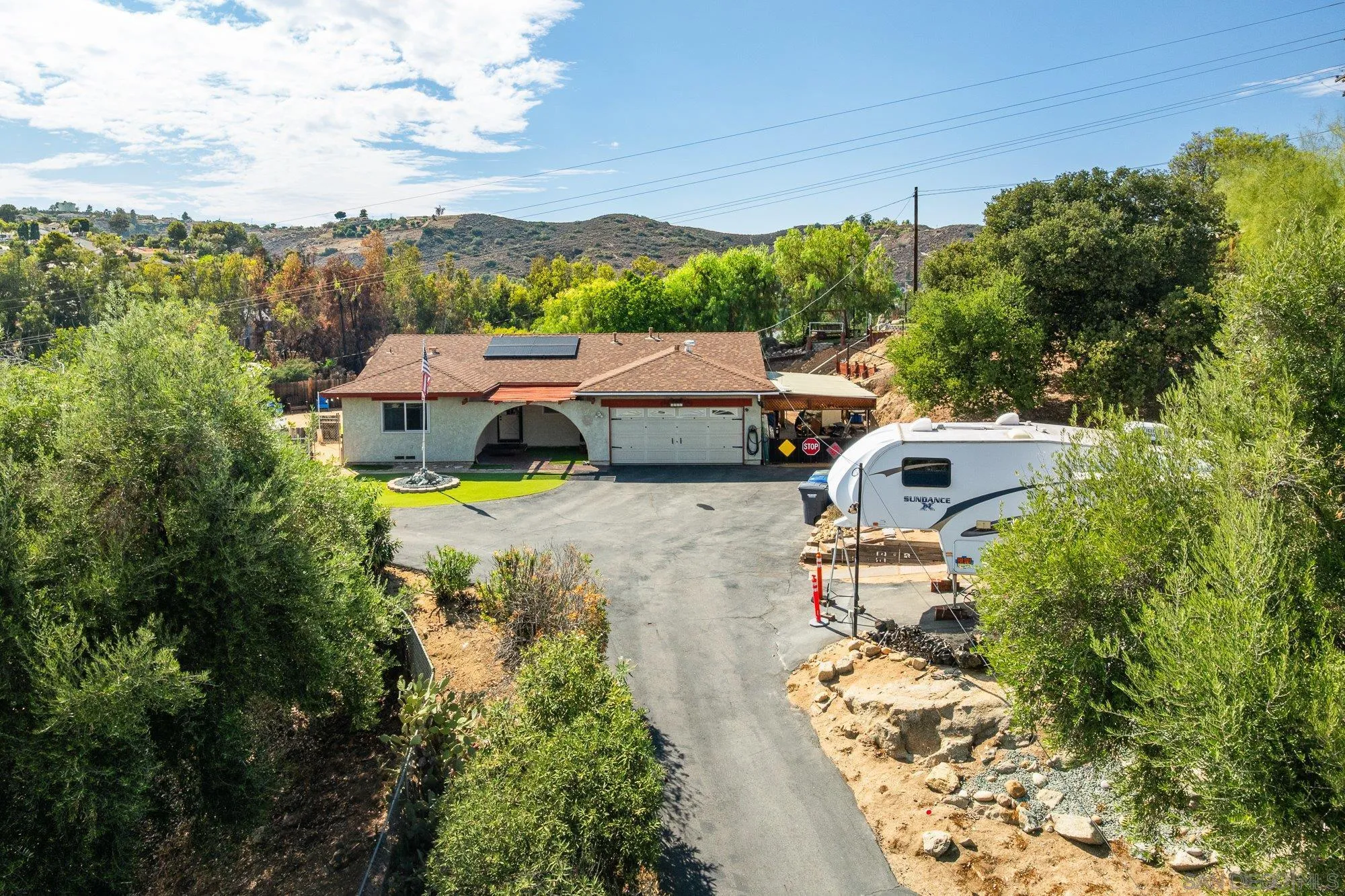 an aerial view of a house with a garden