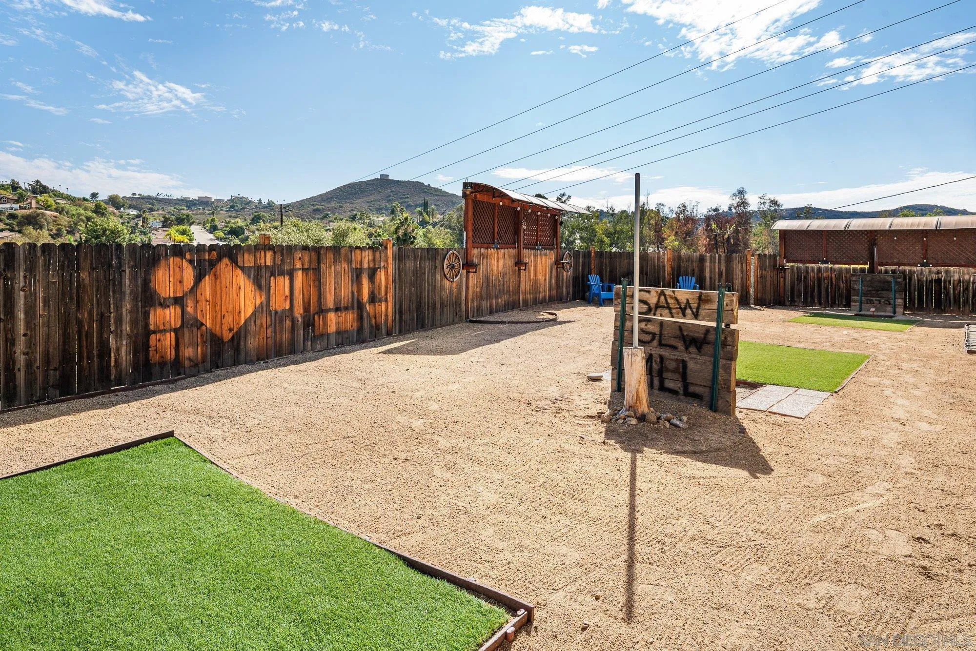 8944 Bower Lane Lakeside, CA 92040 - Photo 25 of 40 a patio with a table and chairs and potted plants