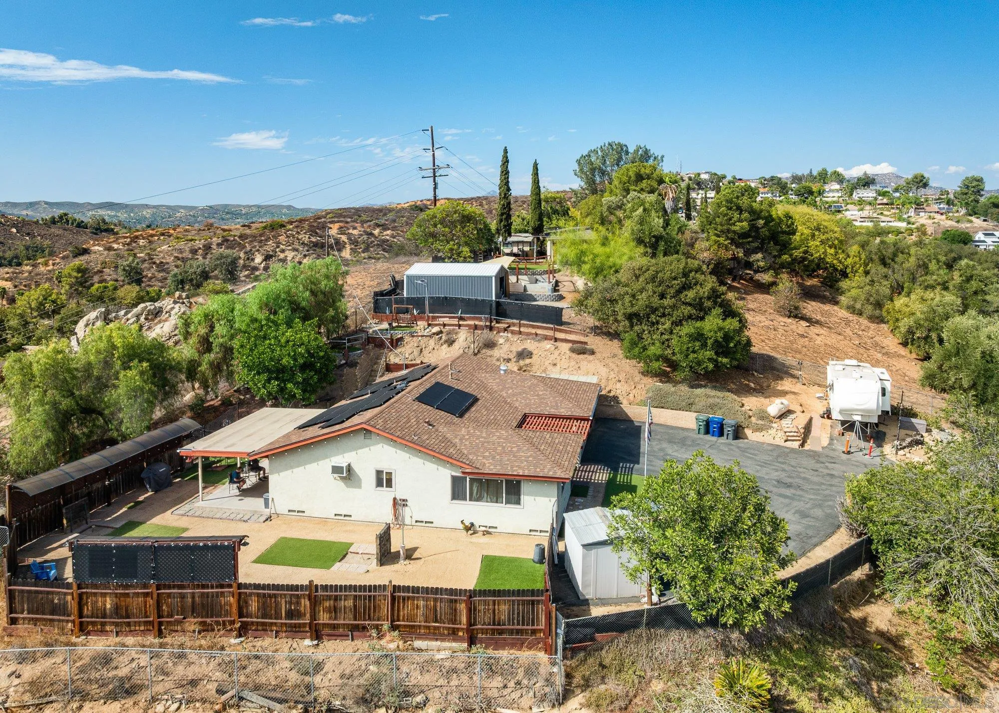 8944 Bower Lane Lakeside, CA 92040 - Photo 34 of 40 a view of a patio with table and chairs and potted plants