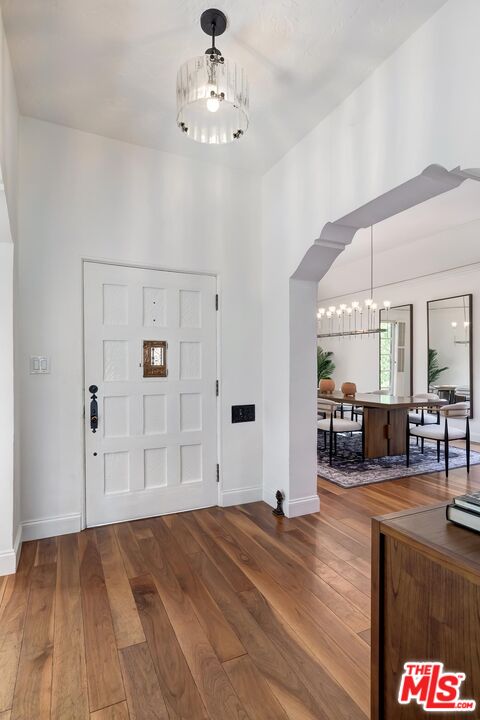 384 North Bonhill Road Los Angeles, CA 90049 - Photo 14 of 32 a view of a livingroom with hardwood floor and a ceiling fan