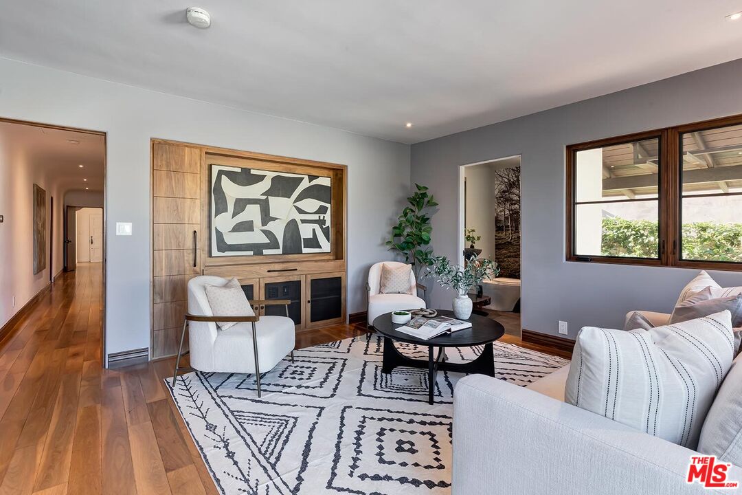 384 North Bonhill Road Los Angeles, CA 90049 - Photo 16 of 32 a living room with furniture and a window