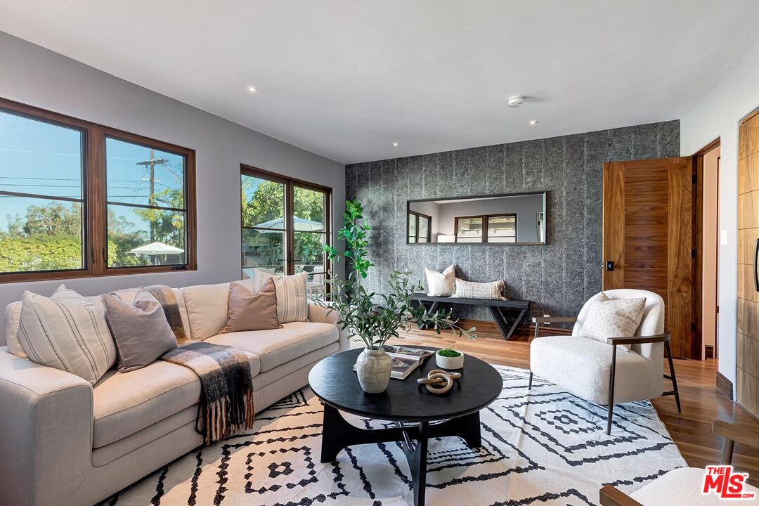384 North Bonhill Road Los Angeles, CA 90049 - Photo 17 of 32 a living room with furniture and a large window