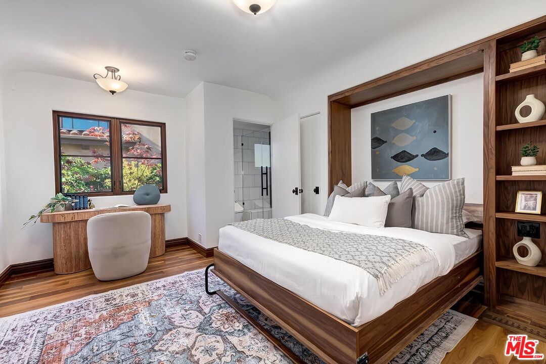 384 North Bonhill Road Los Angeles, CA 90049 - Photo 25 of 32 a bedroom with a large bed and a couch