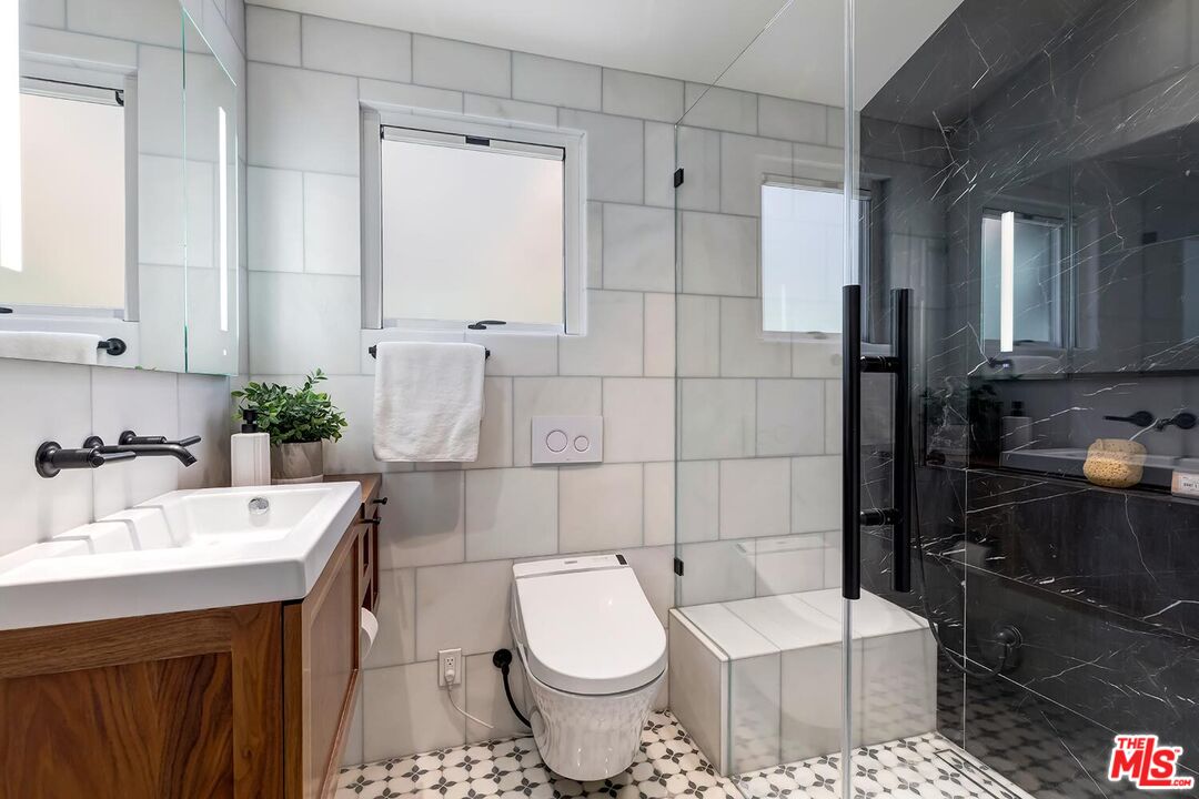 384 North Bonhill Road Los Angeles, CA 90049 - Photo 26 of 32 a bathroom with a sink toilet and shower